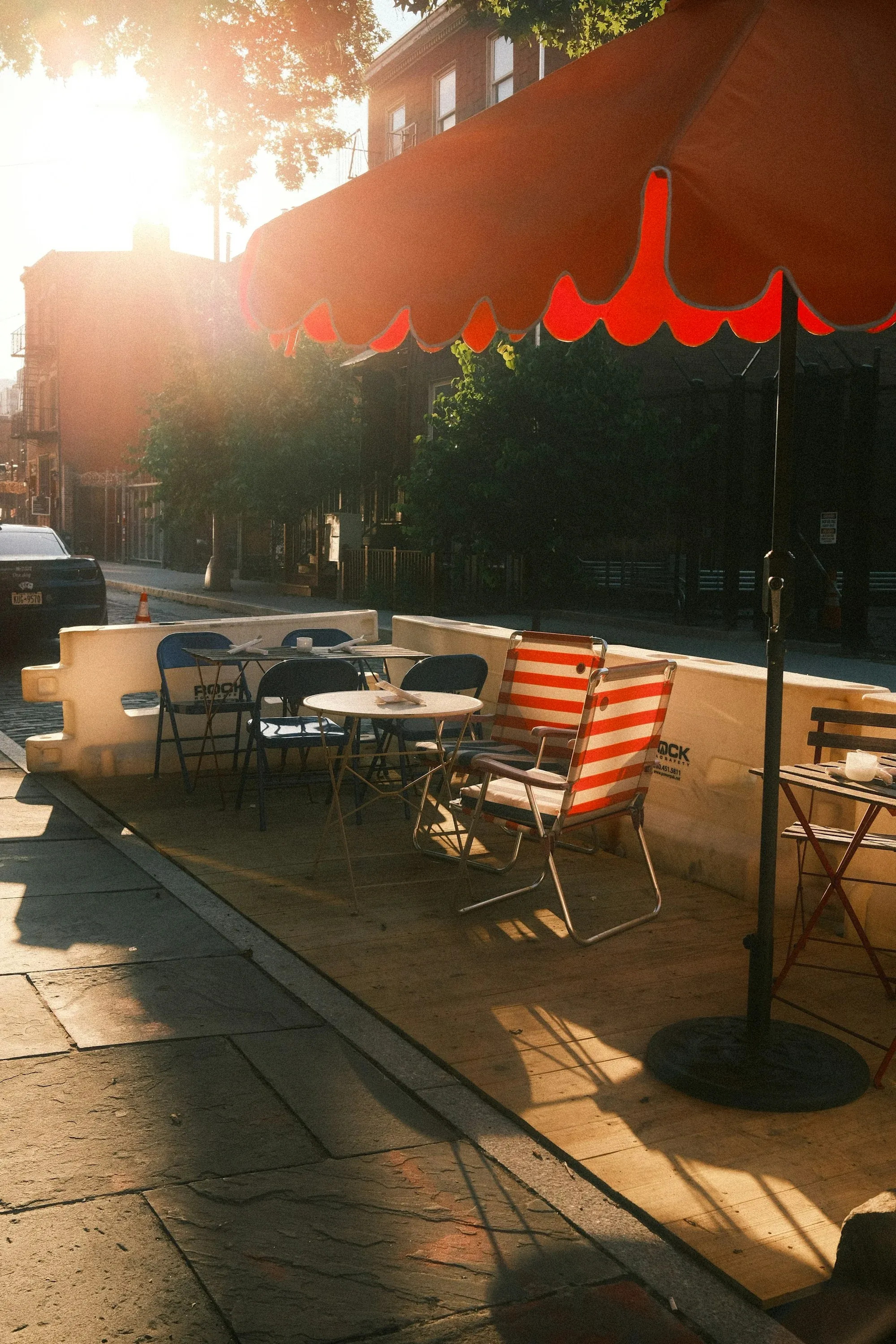 Sunlit outdoor café seating, illustrative photograph